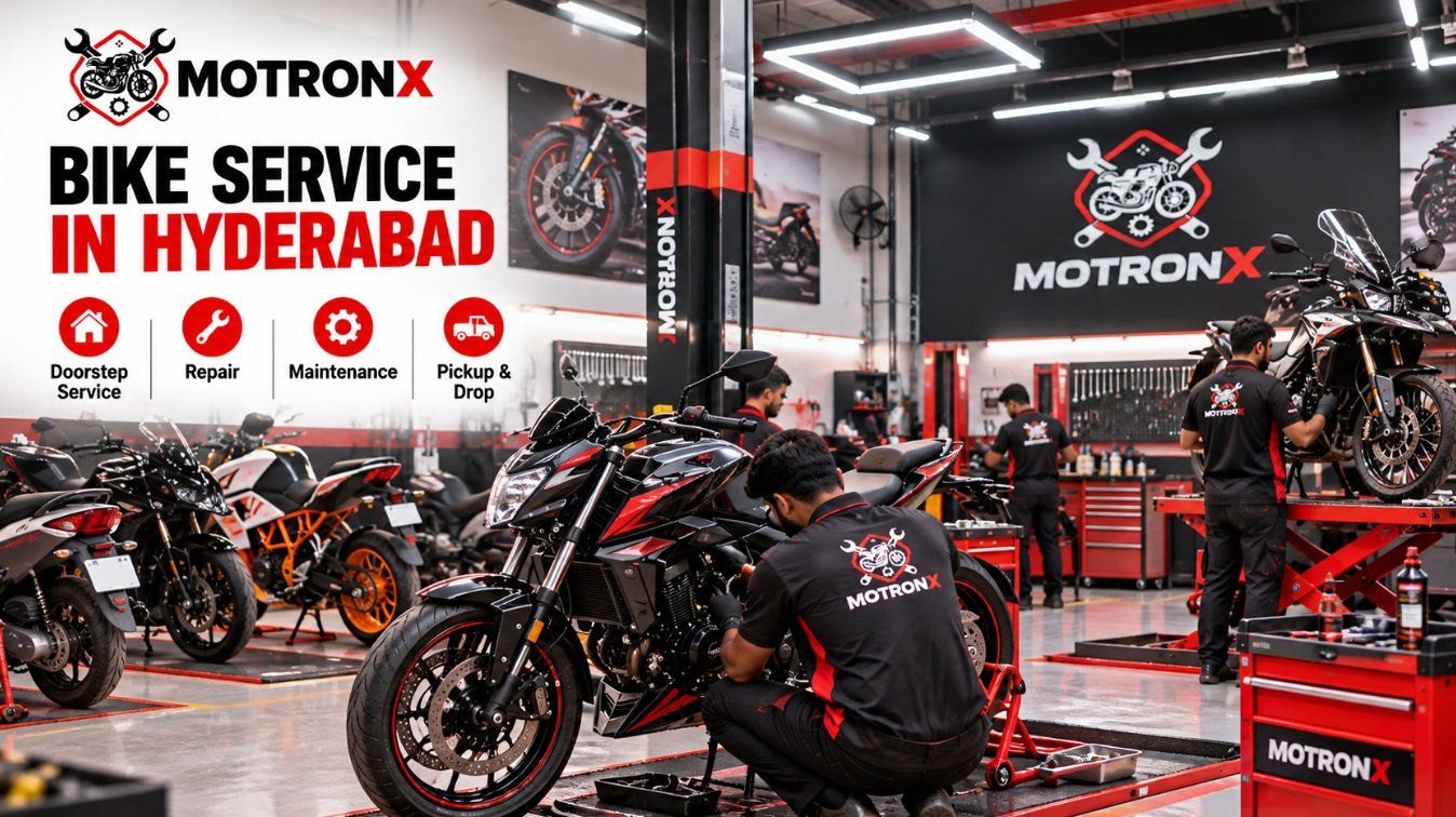 MotronX bike service in Hyderabad with mechanics servicing motorcycles inside a professional garage Copy alt text
